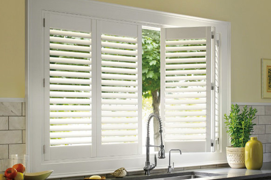 Polywood shutters are built to withstand the test of time in Bluff City. White Polywood shutters above a kitchen sink.